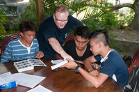 Christian with young students from Tongkaina Solagratia school